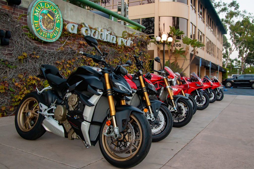 Ducati Diavel and multiple Panigale models lined up at Muldoon's Pub in Orange County during bike night
