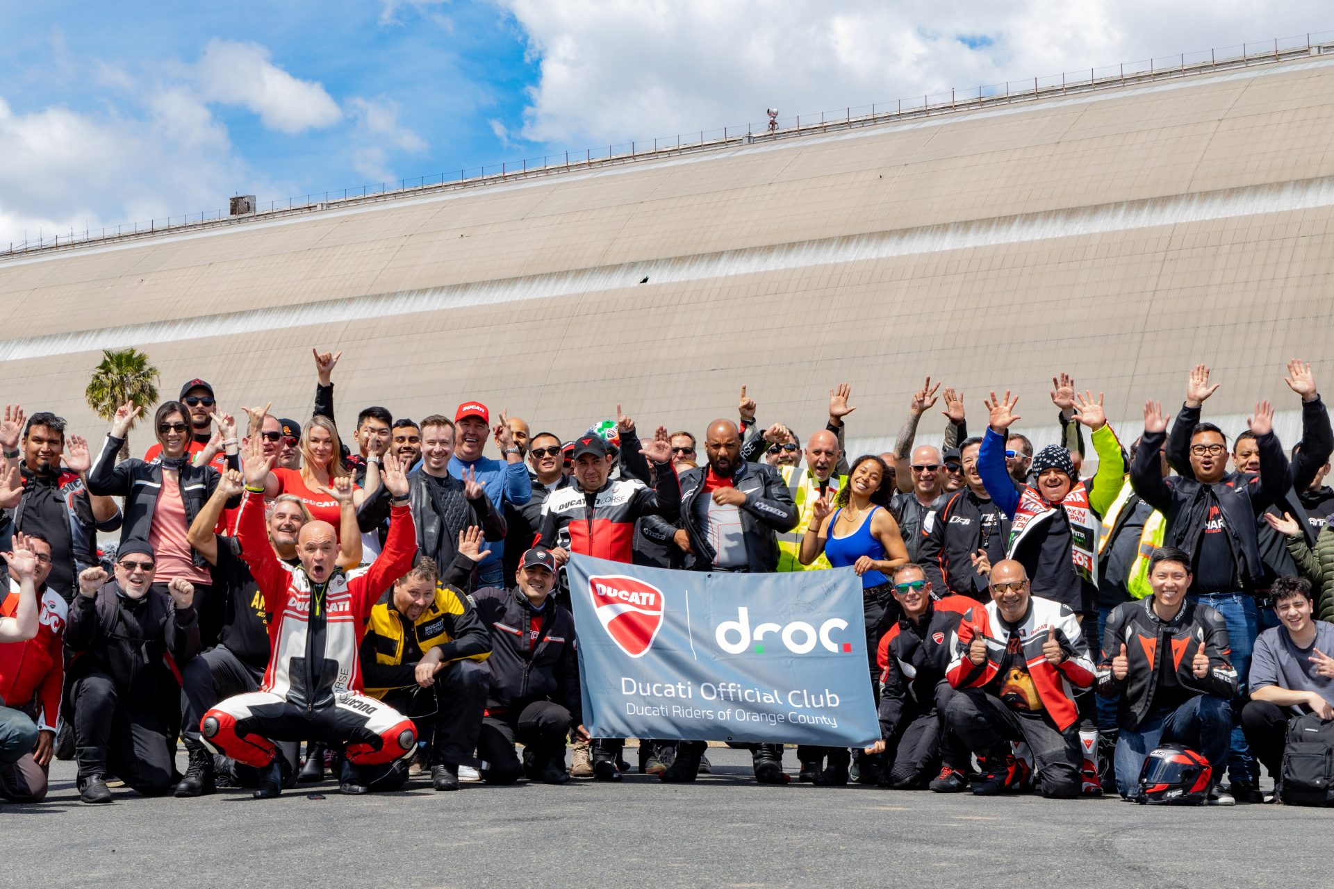 DROC members celebrating at a Ducati event in Orange County, showcasing camaraderie and passion for motorcycles