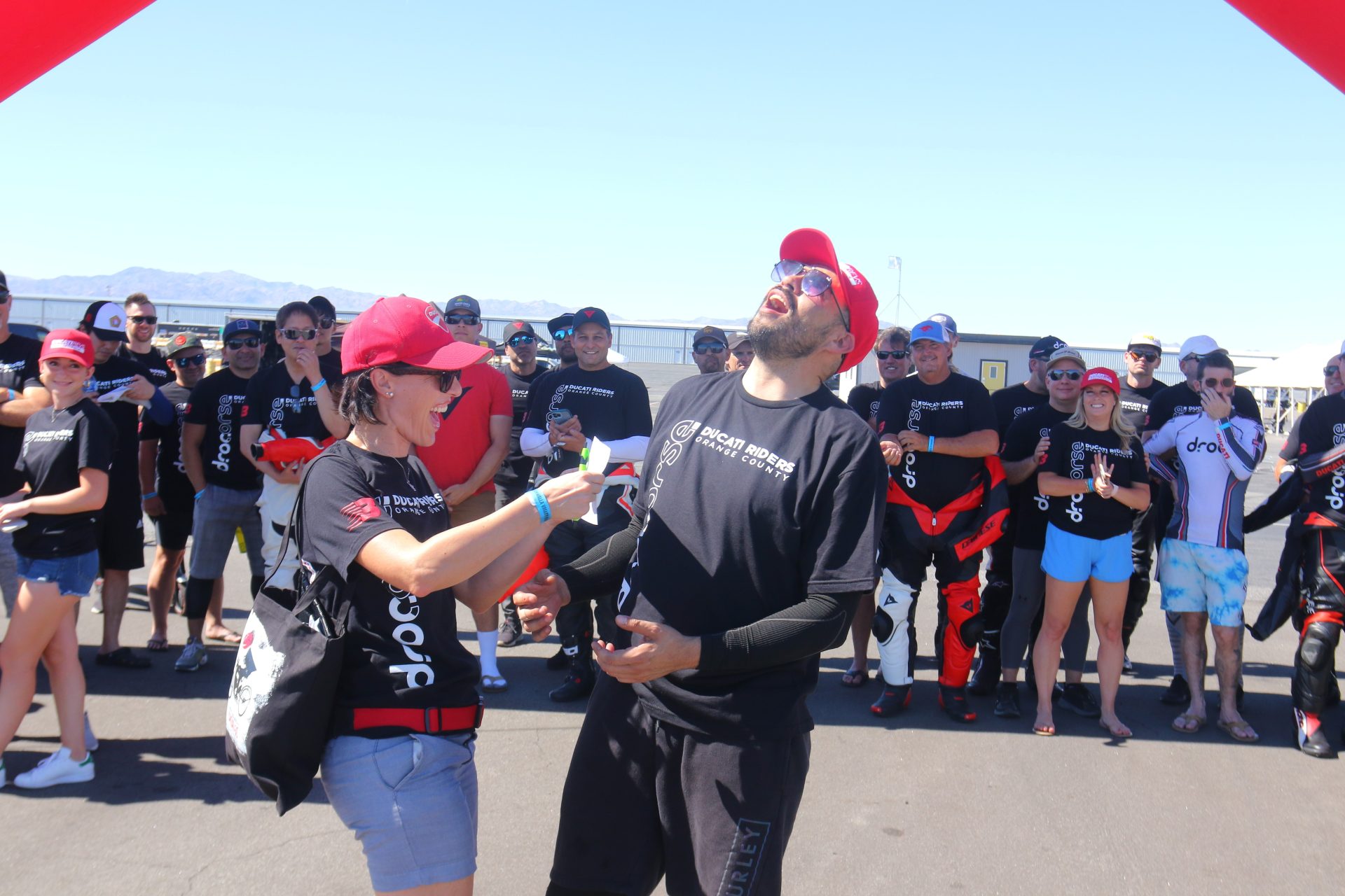 Ducati Riders of Orange County event with members enjoying activities under clear skies