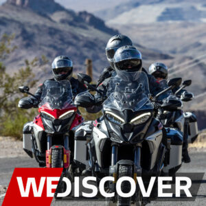 Ducati Multistrada riders cruising through scenic Orange County mountains during a group ride event