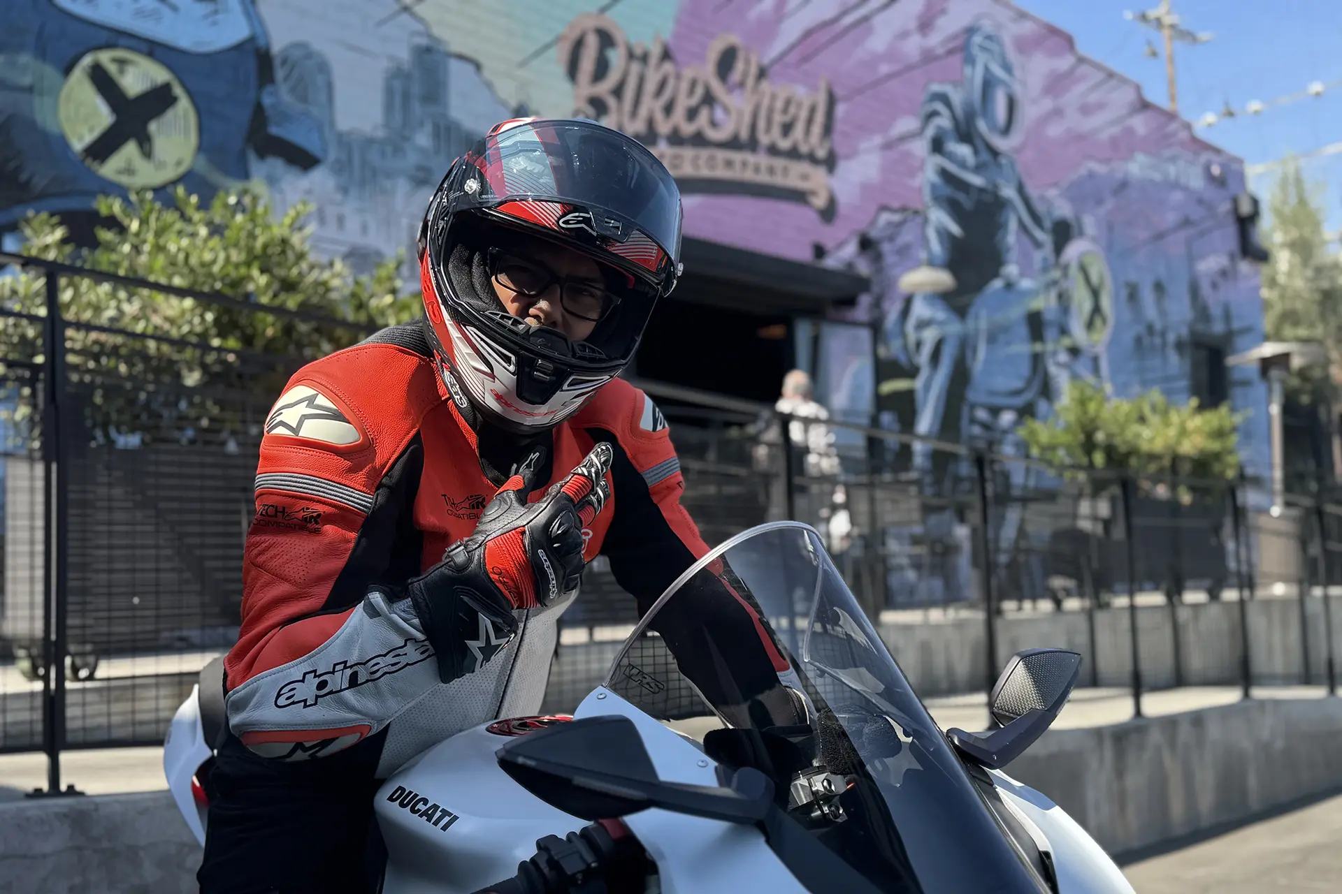 Ducati rider in gear at Bike Shed in Orange County, showcasing club benefits and a passion for motorcycling