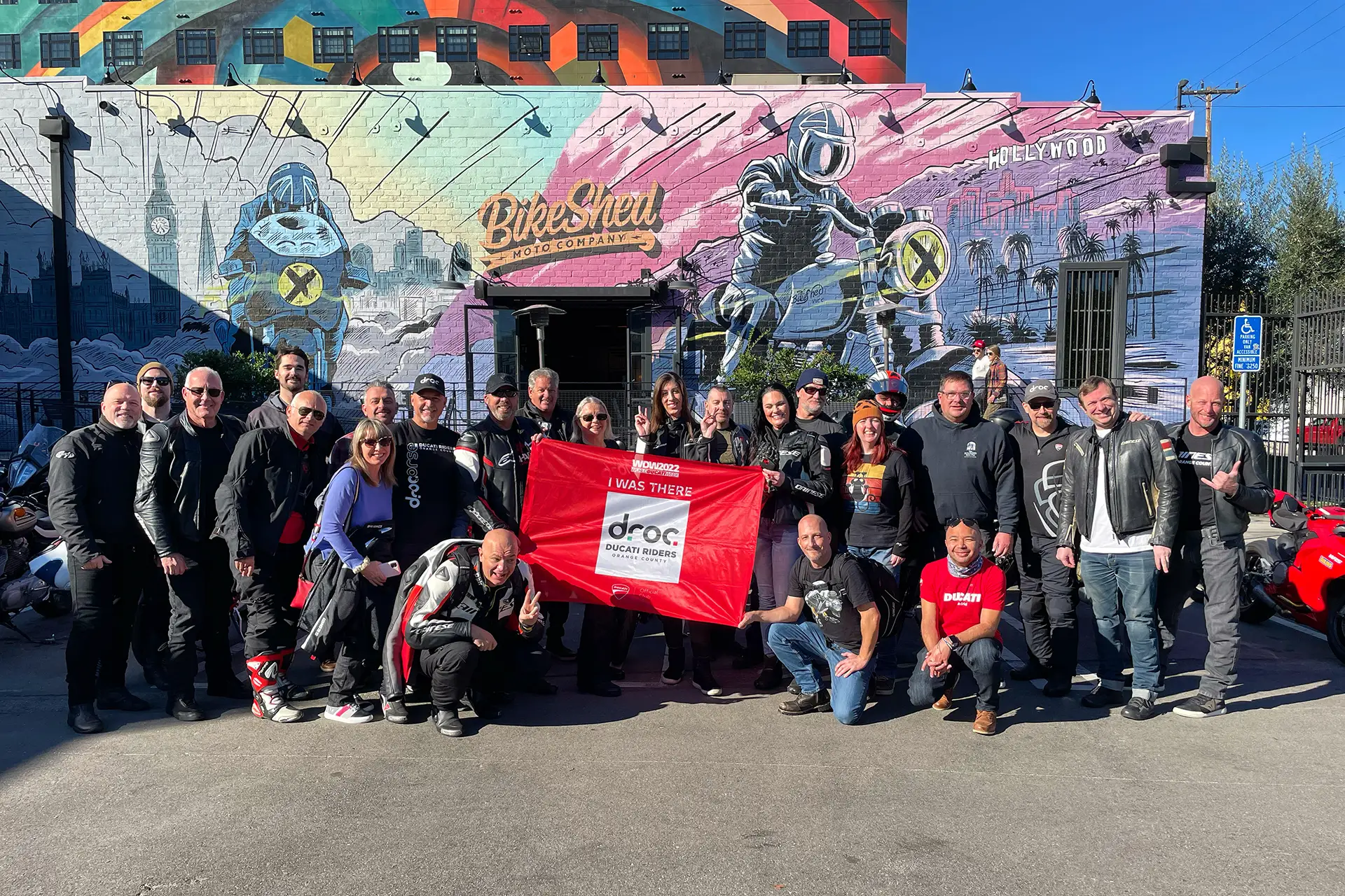 Ducati Riders of Orange County group photo outside Bike Shed, showcasing community benefits and camaraderie