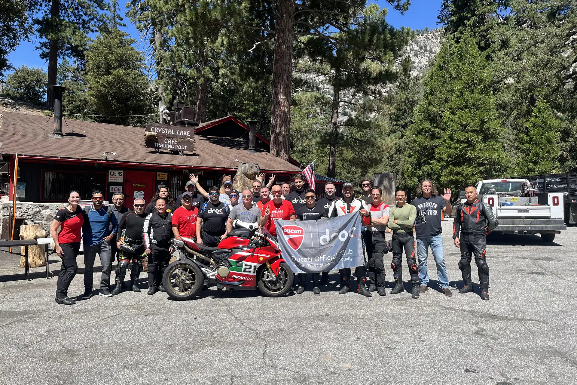 Ducati riders at Crystal Lake enjoy group benefits with a Panigale, celebrating camaraderie in Orange County