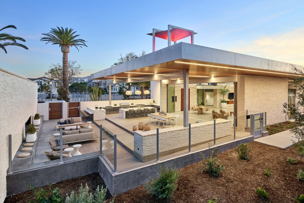 DROC holiday party venue featuring a modern outdoor space with seating and palm trees in Orange County