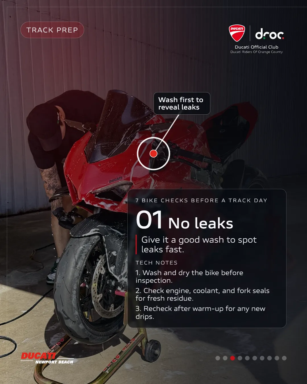 Ducati motorcycle being washed for inspection before a track day to check for leaks and ensure safety