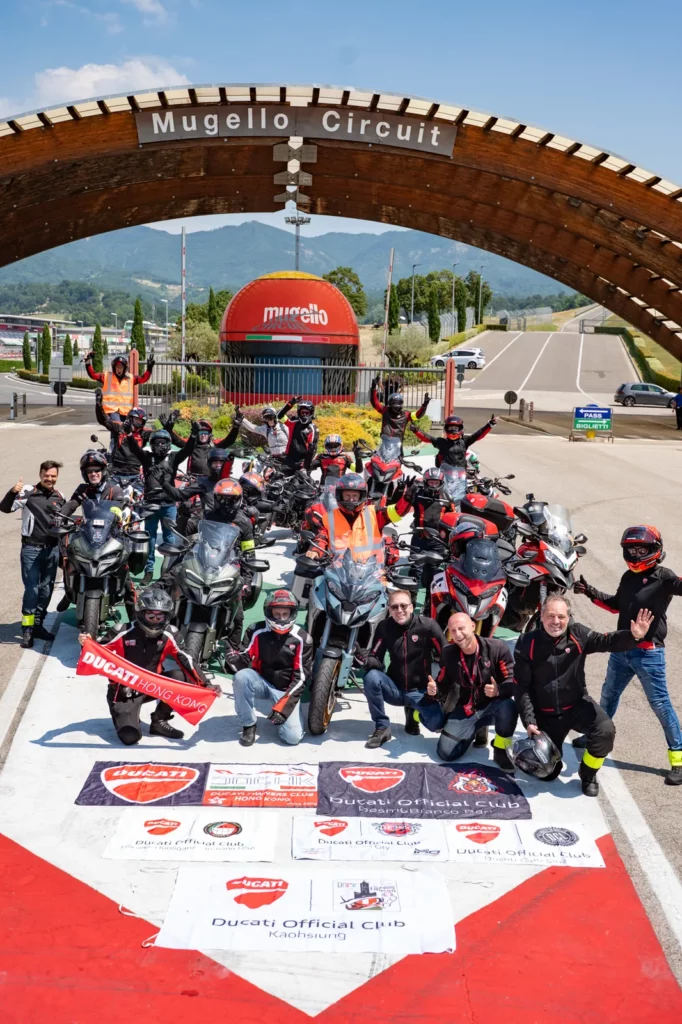 Ride with DROC: the six ways we ride 30 Ducati riders and their bikes under the Mugello Circuit arch, with Ducati Official Club banners from Hong Kong and Kaohsiung
