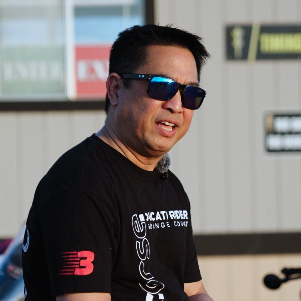DROC member Jun Valenton in a Ducati Riders of Orange County shirt, filmed for Voices of the Track