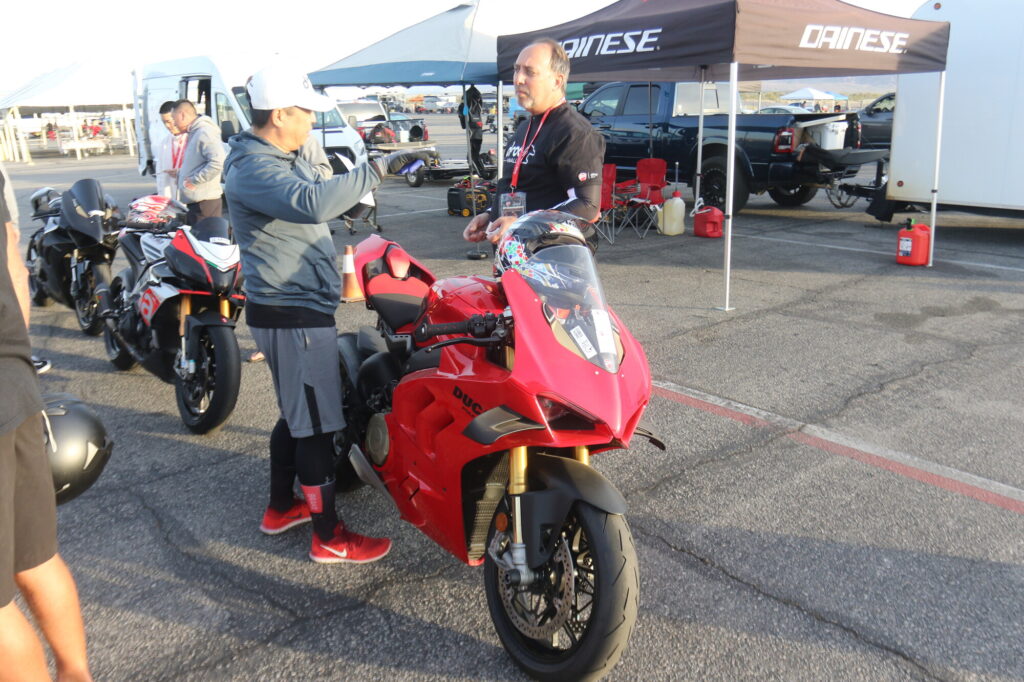 Jun Valenton: "Be very, very cautious, because it's very, very addicting" 1 DROC member Jun Valenton beside his red Ducati Panigale V4 in the paddock at Chuckwalla Valley Raceway
