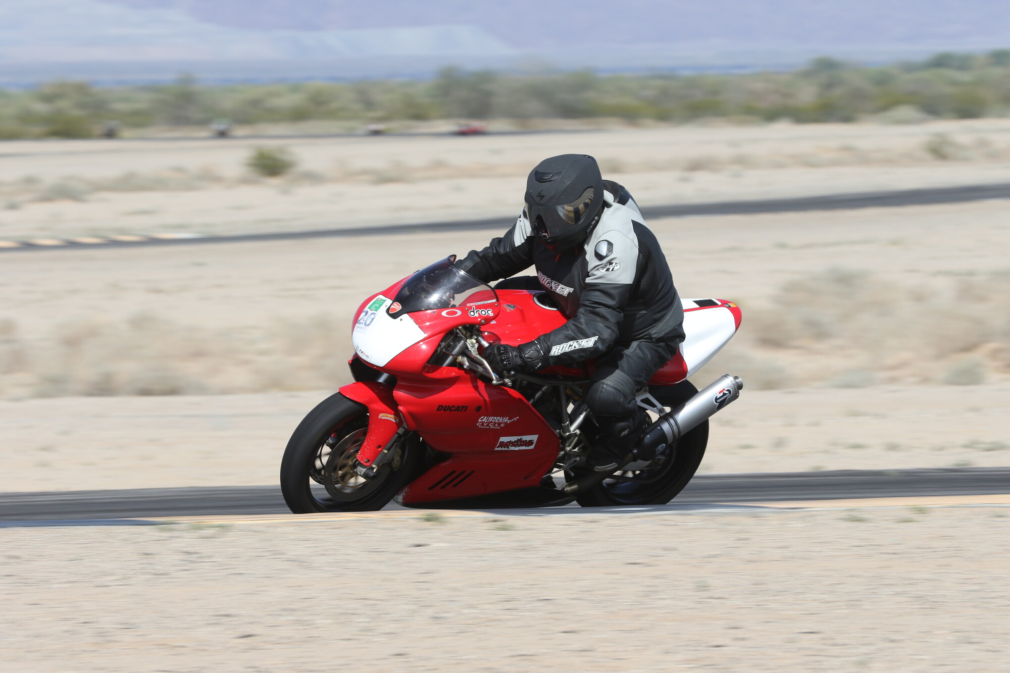 Patrick Pallan leaned into a corner on his red and white Ducati at Chuckwalla Valley Raceway