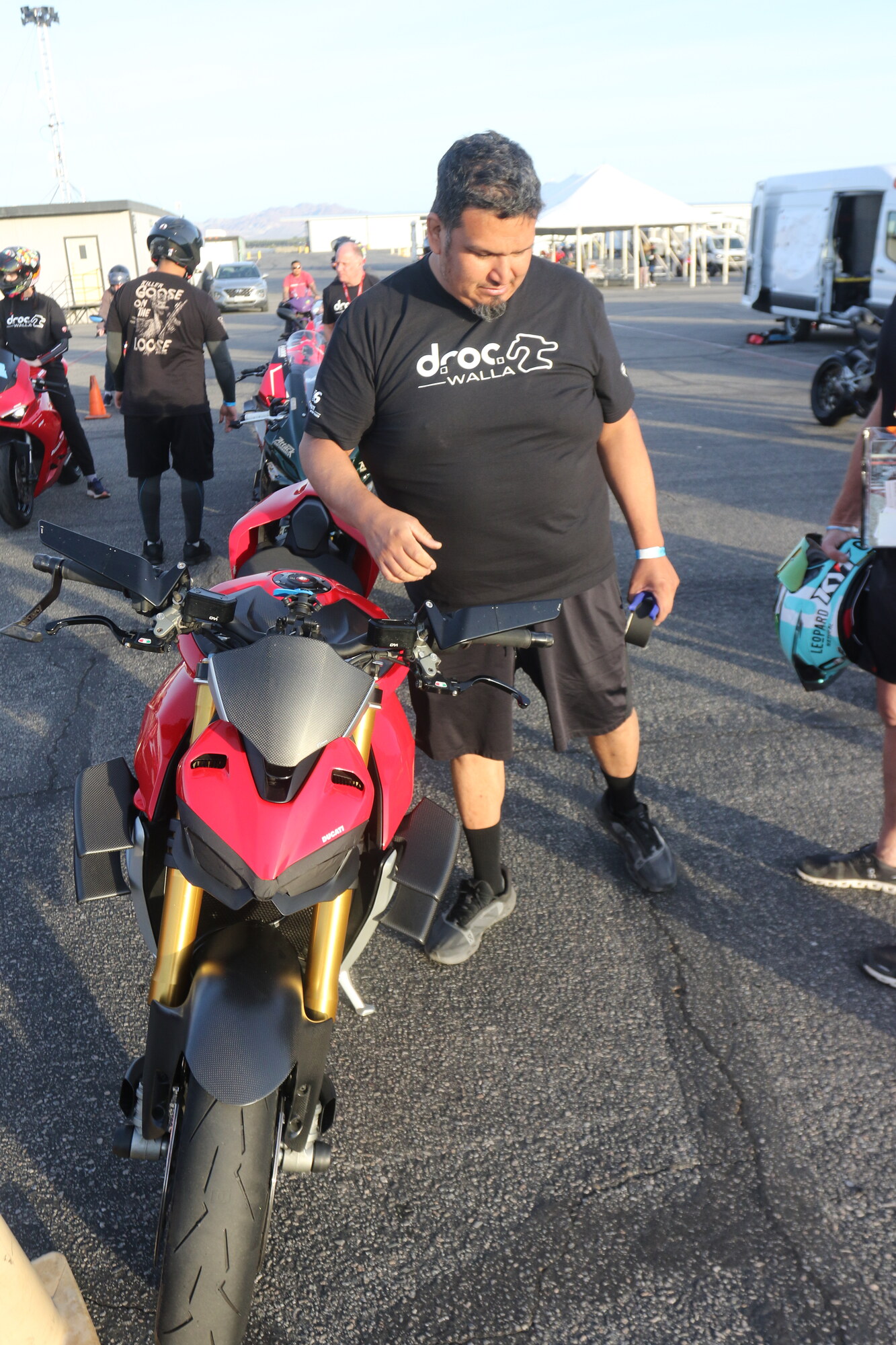 DROC member Patrick Pallan in a DROC Chuckwalla shirt in the paddock at Chuckwalla Valley Raceway