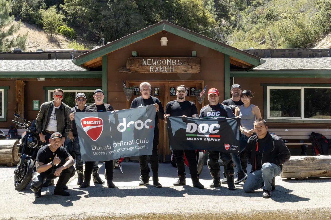 DROC members holding the club banner outside Newcomb’s Ranch on the Angeles Crest Highway