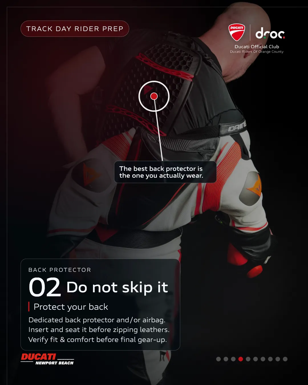 Rider preparing for a track day, wearing protective gear and back protector for safety during motorcycle events