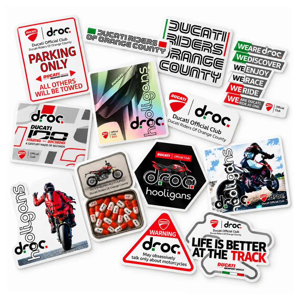A spread of DROC stickers: the Parking Only sign, Ducati Riders of Orange County lettering, the We Are DROC stack, Ducati 100, droc hooligans designs, a Warning sign that reads May obsessively talk only about motorcycles, and Life Is Better At The Track